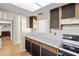 Kitchen with wood cabinets and stove top at 6625 Scotsman Crescent, Myrtle Beach, SC 29588