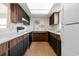 Galley kitchen with wood cabinets and appliances at 6625 Scotsman Crescent, Myrtle Beach, SC 29588