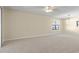 Spacious living room featuring a ceiling fan and large window at 6625 Scotsman Crescent, Myrtle Beach, SC 29588