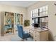 Virtually staged home office with built-in shelving at 6625 Scotsman Crescent, Myrtle Beach, SC 29588