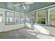 Sunroom with ample natural light and a ceiling fan at 6625 Scotsman Crescent, Myrtle Beach, SC 29588