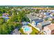 Aerial view of homes in a community with mature trees and a community pool at 910 Emanon St., North Myrtle Beach, SC 29582