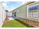 Backyard featuring a white fence, turf grass, and a view of the side of the house at 910 Emanon St., North Myrtle Beach, SC 29582