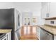 Open kitchen layout with granite countertops, stainless steel appliances, and easy access to the living area at 910 Emanon St., North Myrtle Beach, SC 29582