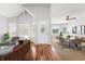 Bright and airy living room with vaulted ceilings, hardwood floors, and a seamless flow into the dining area at 910 Emanon St., North Myrtle Beach, SC 29582