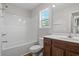 Clean bathroom with a tub, toilet, and brown vanity at 355 Barn Owl Way, Conway, SC 29527