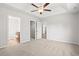 Spacious bedroom with carpeting, an en-suite bathroom and walk-in closet at 623 Snowy Owl Way, Conway, SC 29527