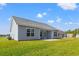 House exterior showcasing gray siding and backyard patio at 623 Snowy Owl Way, Conway, SC 29527