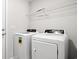 Laundry room with washer, dryer, and ample shelving at 623 Snowy Owl Way, Conway, SC 29527