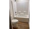 Bathroom includes a bathtub, shower, toilet and wood-look floors at 882 Liberty Church Rd., Loris, SC 29569