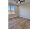 Bright bedroom features wood-look floors and a ceiling fan at 882 Liberty Church Rd., Loris, SC 29569