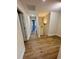 Upstairs hallway with wood-look floors and access to bedrooms at 882 Liberty Church Rd., Loris, SC 29569