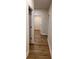 Hallway with light walls and wood flooring, leading to bedrooms at 882 Liberty Church Rd., Loris, SC 29569