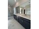 Double vanity bathroom with dark cabinets and quartz countertops at 573 Beckham Ct., Murrells Inlet, SC 29576