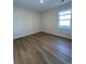 Well-lit bedroom with hardwood flooring at 573 Beckham Ct., Murrells Inlet, SC 29576