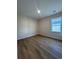 Light-filled bedroom featuring hardwood floors at 573 Beckham Ct., Murrells Inlet, SC 29576