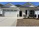 Newly constructed home with a two-car garage and attractive landscaping at 573 Beckham Ct., Murrells Inlet, SC 29576