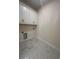 Bright laundry room with white cabinets and tile floor at 573 Beckham Ct., Murrells Inlet, SC 29576