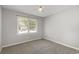 Bedroom with neutral carpet, a ceiling fan, and window at 9138 Wildwood Pl., Murrells Inlet, SC 29576