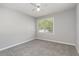 Bedroom with neutral carpet, a ceiling fan, and window at 9138 Wildwood Pl., Murrells Inlet, SC 29576