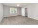 Bedroom featuring carpeted floors and a window allowing natural light at 9138 Wildwood Pl., Murrells Inlet, SC 29576