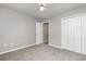 Bedroom offers neutral carpet, a ceiling fan, and closet at 9138 Wildwood Pl., Murrells Inlet, SC 29576