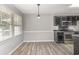 Dining nook with stainless steel appliances and modern light fixture at 9138 Wildwood Pl., Murrells Inlet, SC 29576