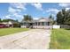 Traditional brick house with well maintained lawn, black shutters, and ample parking at 9138 Wildwood Pl., Murrells Inlet, SC 29576