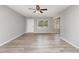 Bright living space with neutral paint, modern light fixtures, and luxury vinyl plank flooring at 9138 Wildwood Pl., Murrells Inlet, SC 29576