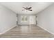 Living room with hardwood floors, a ceiling fan, and natural light at 9138 Wildwood Pl., Murrells Inlet, SC 29576