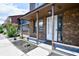 Inviting front porch with brick facade and landscaping at 1466 Glenns Bay Rd. # 1466, Surfside Beach, SC 29575