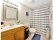 Clean bathroom with a shower/tub combo and wood vanity at 501 Maison Dr. # B3, Myrtle Beach, SC 29572