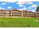 Multi-story building exterior with grassy lawn at 501 Maison Dr. # B3, Myrtle Beach, SC 29572