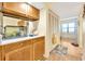 Small kitchenette with cabinets, a sink and a fish tank at 501 Maison Dr. # B3, Myrtle Beach, SC 29572