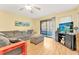 Comfortable living room featuring hardwood floors and balcony access at 501 Maison Dr. # B3, Myrtle Beach, SC 29572