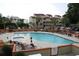 Inviting community pool with plenty of lounge chairs at 501 Maison Dr. # B3, Myrtle Beach, SC 29572