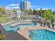 Lazy river pool with surrounding lounge chairs at 2000 S Ocean Blvd. # 203V, Myrtle Beach, SC 29577