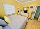 Bright bedroom features a comfortable bed, ample natural light, and tasteful decor, creating a welcoming atmosphere at 6001 - 1795 S Kings Hwy., Myrtle Beach, SC 29575
