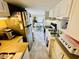 Kitchen with stainless steel appliances and white cabinets overlooking dining area, with eat-in bar, great for entertaining at 6001 - 1795 S Kings Hwy., Myrtle Beach, SC 29575