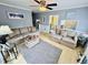 Cozy living room with hardwood floors, soft lighting, and comfortable couches for relaxing or entertaining at 6001 - 1795 S Kings Hwy., Myrtle Beach, SC 29575