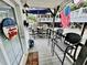 Inviting covered porch with outdoor seating and welcoming decor, perfect for summer days at 6001 - 1795 S Kings Hwy., Myrtle Beach, SC 29575