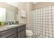 Bathroom featuring granite countertops, a white sink, and a shower with a white and black curtain at 1266 Brighton Hill Ave., Myrtle Beach, SC 29588