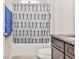 Charming bathroom featuring a shower-tub combo with patterned curtain and granite countertop at 1266 Brighton Hill Ave., Myrtle Beach, SC 29588