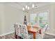 Cozy dining room with a wooden table, stylish chairs, and natural light at 1266 Brighton Hill Ave., Myrtle Beach, SC 29588