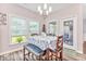 Open dining room with a chandelier, large windows, and a view of the backyard at 1266 Brighton Hill Ave., Myrtle Beach, SC 29588