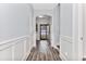 Hallway featuring chair rail, modern floors and an arched doorway leading to the entry at 1266 Brighton Hill Ave., Myrtle Beach, SC 29588