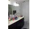 Bathroom featuring double sinks, dark wood cabinets, and a shower/tub combo at 157 Blue Jacket Dr., Galivants Ferry, SC 29544