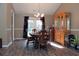 The dining room features an elegant chandelier, French doors, and wood flooring at 157 Blue Jacket Dr., Galivants Ferry, SC 29544