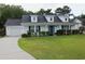 Charming single Gathering home showcasing manicured lawn and attached garage at 157 Blue Jacket Dr., Galivants Ferry, SC 29544