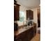 Kitchen featuring stainless steel sink, wooden cabinetry and granite countertops at 157 Blue Jacket Dr., Galivants Ferry, SC 29544